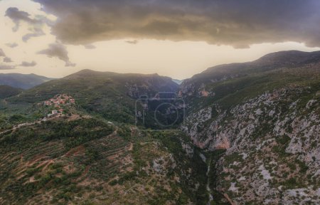 Photo for Aerial scenic view from over the famous Ridomo gorge in Taygetus Mountain. The Gorge is deep and rich in geomorphological formation elements located near Kentro Avia and Pigadia Villages in Mani area, Messenia, Greece - Royalty Free Image