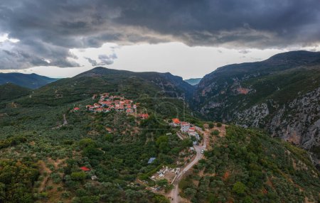 Photo for Aerial scenic view from over the famous Ridomo gorge in Taygetus Mountain. The Gorge is deep and rich in geomorphological formation elements located near Kentro Avia and Pigadia Villages in Mani area, Messenia, Greece - Royalty Free Image