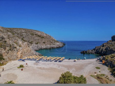 Photo for Aerial panoramic view of the famous rocky beach Melidoni in Kythira island at sunset. Amazing scenery with crystal clear water and a small rocky gulf, Mediterranean sea, Greece in Europe. - Royalty Free Image