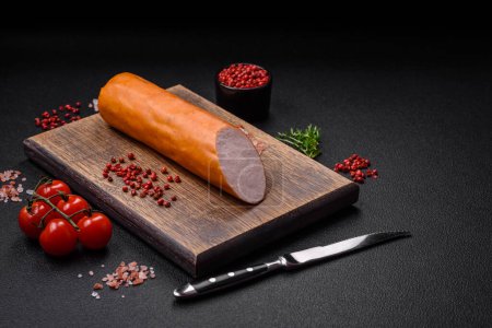 Photo for Delicious smoked chicken sausage with salt, spices and herbs on a dark concrete background - Royalty Free Image