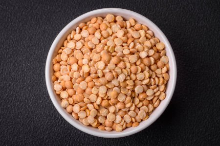 Photo for Dried pea grains, divided into halves, are yellow in color when raw. Prepare a delicious nutritious side dish - Royalty Free Image