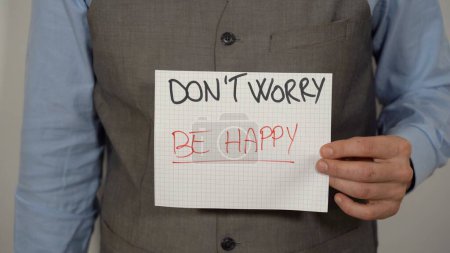 Foto de Business man with write Don't worry be happy , Time is now ( carpe diem ) - positive message and lifestyle - Imagen libre de derechos