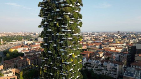 Photo for Europe, Italy,Milan 08-18-2023 - drone aerial view of Vertical Forest ( bosco verticale ) luxury skyscraper ecological and sustainable with trees and greenery on the facades in Gae Aulenti new skyline - Royalty Free Image