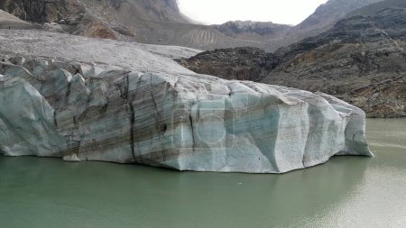 Photo for Europe, Italy, Sondrio Valmalenco Alpe Gera- drone view of Fellaria glacier in Alps - rapid melting of ice iceberg causes sea level rise. Global warming and climate change cause drought and aridity - Royalty Free Image