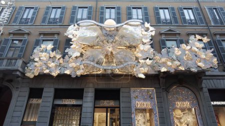 Photo for Europe, Italy, Milan 11-28-2023 - Via Montenapoleone fashion district in downtown Luxury shop boutique windows for Christmas decorations - Dior shopping store - Royalty Free Image