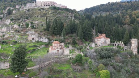Photo for Mystras or Mistras, also known in the Chronicle of the Morea as Myzethras or Myzithras, is a fortified town and a former municipality in Laconia, Peloponnese, Greece. Ruines drone aerial view - Royalty Free Image
