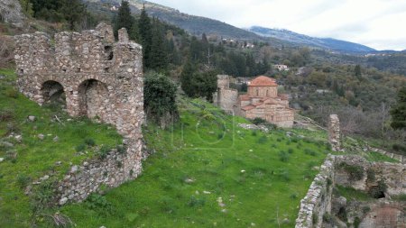 Mystras or Mistras, also known in the Chronicle of the Morea as Myzethras or Myzithras, is a fortified town and a former municipality in Laconia, Peloponnese, Greece. Ruines drone aerial view