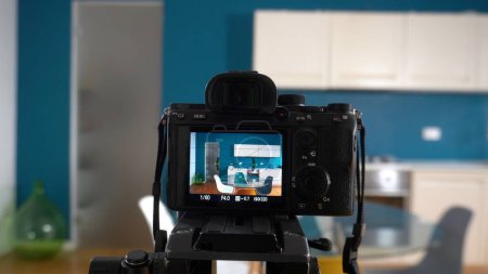 Photo for Taking pictures and videos at house in apartment living room with professional camera - selling home with real estate agency and home staging indoor home design - Royalty Free Image