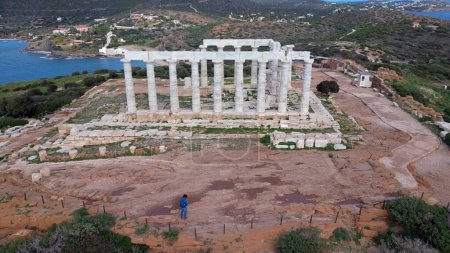 Temple of Poseidon is one of the most famous monuments in Greece, perched on a rocky Cape Sounion overlooking the Mediterranean sea.