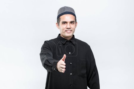 Photo for Asian Muslim men standing, hello, greeting with a smiley face, on white background. - Royalty Free Image