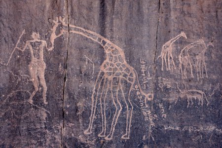 Photo for PREHISTORIC ART, ROCK AND CAVE PAINTINGS IN THE SAHARA REGION OF TADRART ROUGE IN ALGERIA - Royalty Free Image