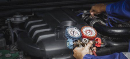 Photo for Car air conditioner check service, leak detection, fill refrigerant.Device and meter liquid cooling in the car by specialist technicians. - Royalty Free Image