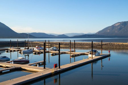 Photo for Shuswap Lake, Salmon Arm Wharf, Canada at sunset with boats - Royalty Free Image
