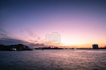 Photo for Sunset over the harbour at Portsmouth in Hampshire, UK - Royalty Free Image