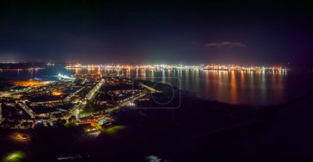 Photo for An aerial view of the ports of Harwich and Felixstowe at night in the UK - Royalty Free Image