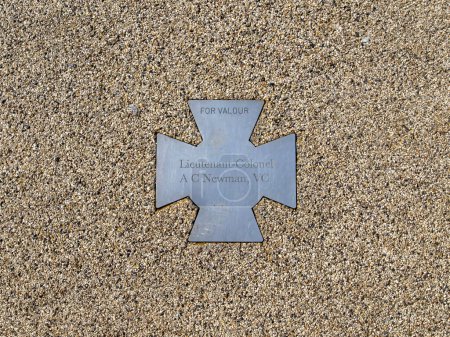 Photo for Lieutenant-Colonel Newman was awarded a Victoria Cross in 1942 and is commemorated by this plaque in Falmouth, Cornwall, UK - Royalty Free Image