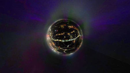 A tiny planet aerial view of the Northern Lights (Aurora Borealis) over Ipswich in Suffolk, UK