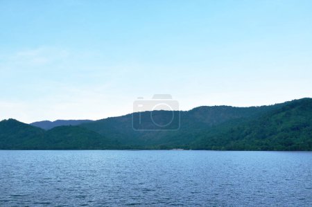 Photo for Landscape of water reservoir lake with mountain background in sunset - Royalty Free Image