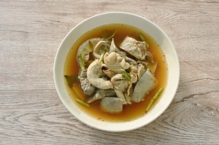 Photo for Boiled hot and spicy soup with pork entrails on plate - Royalty Free Image