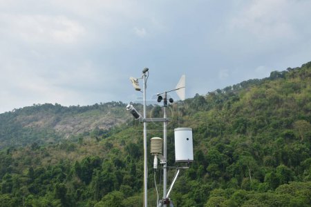 wind speed measurement using vane in mountain background with rain cloud on sky