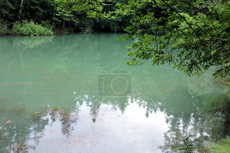 Photo for A view of an azure lakelet among trees in Rudawy Janowickie, Sudetes mountains, Poland - Royalty Free Image