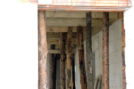 Photo for Wooden building props inside a house under construction - Royalty Free Image