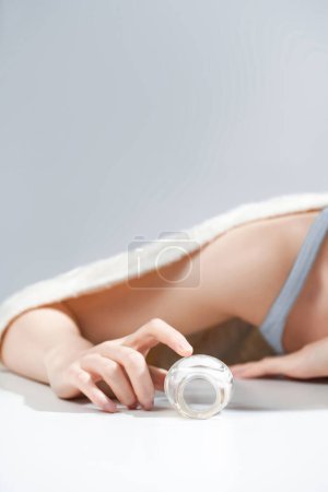 Photo for Beautiful Woman Hands. Female Hands Applying Cream, Lotion. Spa and Manicure concept. Female hands with french manicure. Soft skin, skincare concept. Hand Skin Care - Royalty Free Image