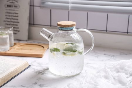 Photo for Filtered water with mint leaves, a simple body detox water that can be made at home - Royalty Free Image