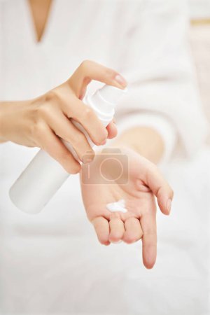 Photo for Beautiful Woman Hands, female Hands Applying Cream, Lotion, Spa and Manicure concept, Female hands with french manicure, - Royalty Free Image