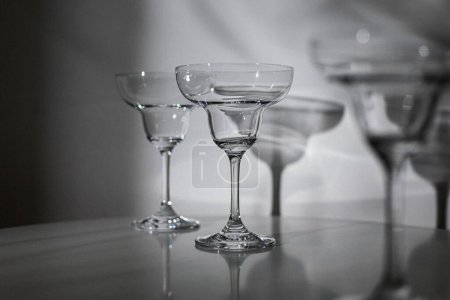 Images of empty wine glasses, empty water glasses, restaurant glasses, wine glasses