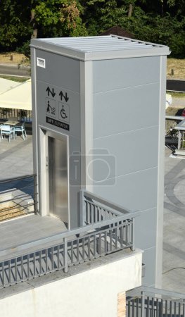Photo for Elevator for disabled people in the wheelchair and parents with baby carriage - Royalty Free Image