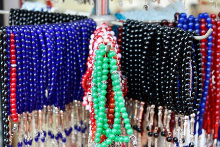 Photo for Tourist attraction - bracelets, necklaces, and other jewelry hangs on the market stalls on the Istanbul bazaar - Royalty Free Image