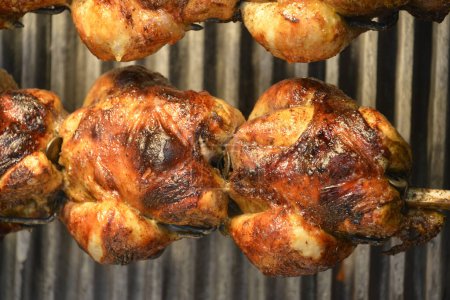 Photo for Juicy roasted chicken on a spit - Royalty Free Image