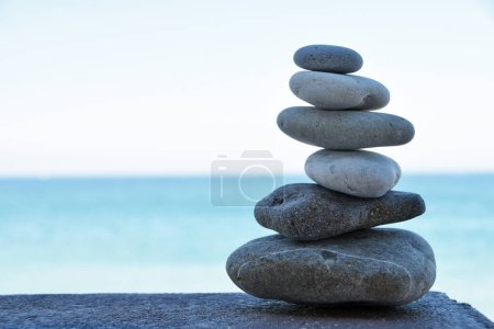 Photo for Stone tower on the beach - stones stacked on each other - Royalty Free Image