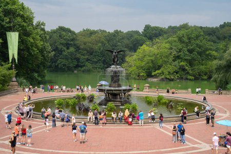 Photo for New York, USA - July 20th, 2023: Tourists and locals enjoying the Bethesda Fountain and the lake in central park, New York city. - Royalty Free Image