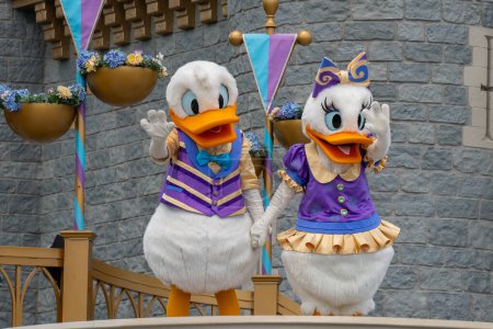 Photo for Orlando, USA - July 25th, 2023: The Donald and Daisy Duck characters in a show in front of the Cinderella castle in Magic Kingdom in Disney World. - Royalty Free Image
