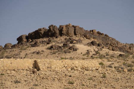 Limestone cliffs, towering in the heat of the Negev desert in the south of Israel.