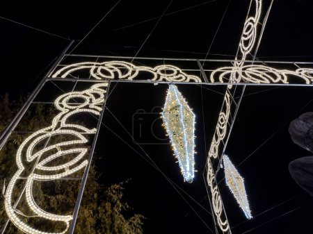 Photo for Christmas decorations made of lights on the streets of Baia Mare city, Romania - Royalty Free Image