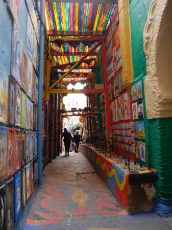 Photo for Bright, colourful passage, paintings displayed on walls, Fez, Morocco. High quality photo - Royalty Free Image