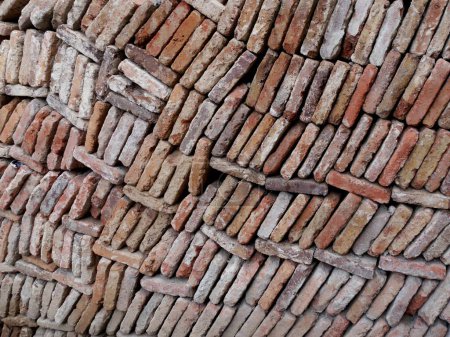Photo for Closeup of piles of reddish brick slates stacked high on building site. High quality photo - Royalty Free Image