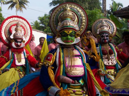 Photo for Traditional music and dancing in the street with people in fabulous colourful costumes representing the different Hindu gods - Royalty Free Image