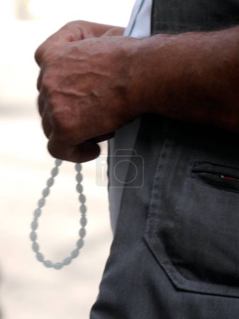 Close up of Turkish man's hands with worry beads, Istanbul, Turkey. High quality photo