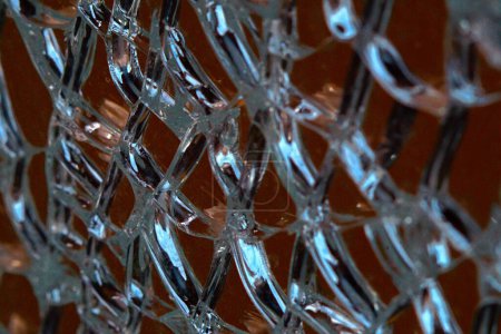 A close-up of a broken car glass