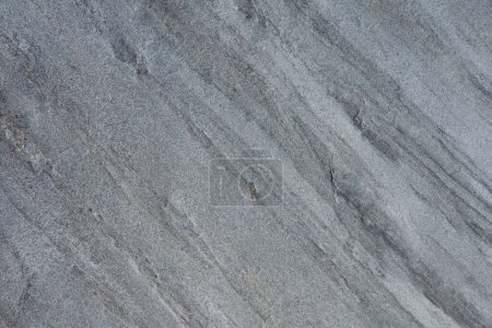 Foto de Muestras de piedra gris con un patrón ondulado para el interior. Textura de piedra natural. Superficie de piedra natural para suelos o decoración de paredes - Imagen libre de derechos
