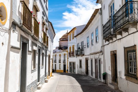 Photo for Evora, Portugal - June 30, 2022: Street in the old town with typical whitewashed houses with balconies. Alentejo, Portugal - Royalty Free Image