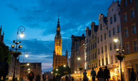 Photo for Scenic summer evening panorama of architectural pedestrians tourists people walk along the evening street of the Old Town GDANSK, POLAND - July 6, 2022 - Royalty Free Image