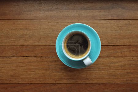 Photo for Close up of a cup of coffee on wooden background - Royalty Free Image