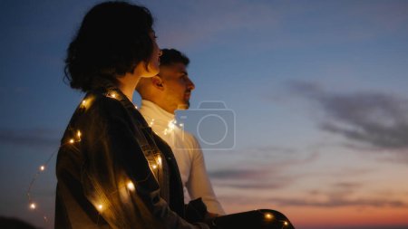 Photo for Lovely couple silhouette on the mountains against the sunset enjoy the valentines day together - Royalty Free Image