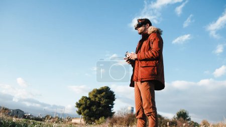 Man landing his fpv drone with virtual reality goggles.