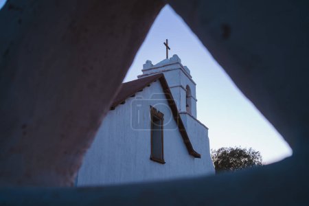 Shot through hole in wall of a bell tower of church in San Pedro de Atacama, Chile